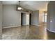 Spacious living room featuring neutral paint, tiled floors, and an open layout great for entertaining at 8759 W Port Au Prince Ln, Peoria, AZ 85381