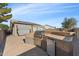 Outdoor kitchen with a stainless steel grill and built-in mini fridge at 10961 W Chase Ln, Avondale, AZ 85323