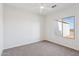 A bedroom with carpet floors, neutral walls, a window, and ample natural light create a comfortable atmosphere at 11227 E Crescent Ave, Mesa, AZ 85208