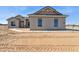 Newly constructed single-story home with modern gray stucco and desert landscaping at 11227 E Crescent Ave, Mesa, AZ 85208
