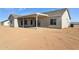 Rear view of desert home, showcasing a covered patio and neutral-colored exterior at 11227 E Crescent Ave, Mesa, AZ 85208