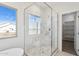 Modern glass shower in a bright main bathroom with neutral flooring and white marble at 11227 E Crescent Ave, Mesa, AZ 85208