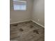 Bedroom with wood floors, visible water damage on the flooring at 11849 N 29Th Ave, Phoenix, AZ 85029
