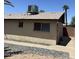 Side view of the home, showing the exterior with desert landscaping and a glimpse of the backyard at 11849 N 29Th Ave, Phoenix, AZ 85029