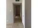The hallway has tile floors and many storage closets at 11849 N 29Th Ave, Phoenix, AZ 85029