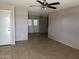 Open-concept living area with tile flooring and access to the backyard through glass doors at 11849 N 29Th Ave, Phoenix, AZ 85029