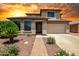Charming two-story home with a well-manicured front yard and an attached two-car garage at 11936 W Alvarado Rd, Avondale, AZ 85392