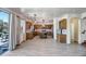 Gourmet kitchen with a large island, stainless steel appliances, granite counters, and wood-look tile flooring at 11936 W Alvarado Rd, Avondale, AZ 85392