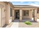 View of the front entrance to the home, with a desert style yard and covered entryway at 12089 N 145Th Dr, Surprise, AZ 85379