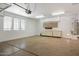 Clean garage with shelving, utility sink and an automatic door at 12089 N 145Th Dr, Surprise, AZ 85379