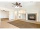 Open-concept living room showcasing a fireplace and seamless flow into other living spaces at 12089 N 145Th Dr, Surprise, AZ 85379