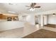 Open floor plan combines kitchen and living areas for a modern and social atmosphere at 12089 N 145Th Dr, Surprise, AZ 85379