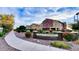 Beautiful Tesoro at Greenfield community entrance with colorful landscaping and clear signage at 1350 S Greenfield Rd # 2231, Mesa, AZ 85206