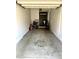 A spacious, empty garage presents an ideal space for parking or storage at 1350 S Greenfield Rd # 2231, Mesa, AZ 85206