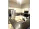 Eat-in kitchen featuring stainless refrigerator and white cabinets at 1350 S Greenfield Rd # 2231, Mesa, AZ 85206