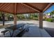 Community picnic area offering shade from the sun with basketball courts in the background at 1350 S Greenfield Rd # 2231, Mesa, AZ 85206
