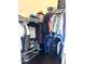 Well-organized walk-in closet with clothing racks, shelves for shoes, and ample space for storage and organization at 1350 S Greenfield Rd # 2231, Mesa, AZ 85206