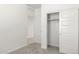 Bedroom with carpet flooring, white walls, and closet with sliding doors at 1375 S 239Th Dr, Buckeye, AZ 85326