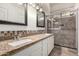 The bathroom features a granite countertop and tiled shower at 14314 W Lexington Ave, Goodyear, AZ 85395