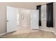 This bedroom shows vinyl floors and an ensuite at 14314 W Lexington Ave, Goodyear, AZ 85395