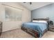 Cozy bedroom with a large bed, neutral walls, and natural light creating a relaxing atmosphere at 14314 W Lexington Ave, Goodyear, AZ 85395