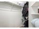 The walk-in closet offers ample storage space with shelving and hanging rods at 14314 W Lexington Ave, Goodyear, AZ 85395