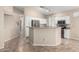 An open kitchen features ample counter space, modern stainless steel appliances, and plenty of storage at 14314 W Lexington Ave, Goodyear, AZ 85395