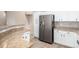 Well-equipped kitchen features stainless steel appliances, granite countertops, and white cabinetry for ample storage at 14314 W Lexington Ave, Goodyear, AZ 85395