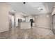 Open-concept living area features tile flooring, neutral walls and plenty of space for entertaining and relaxation at 14314 W Lexington Ave, Goodyear, AZ 85395