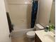 Bathroom featuring a shower-tub combo, toilet, and vanity with modern fixtures and ample lighting at 14700 N El Frio St, El Mirage, AZ 85335