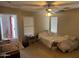 Neutral bedroom featuring a ceiling fan, window blinds, and a comfortable space at 14700 N El Frio St, El Mirage, AZ 85335