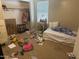 Bedroom featuring a daybed, desk, built in closet and window providing natural light at 14700 N El Frio St, El Mirage, AZ 85335