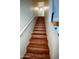 Staircase with hardwood steps and white railing leading to the upper level at 1645 W Baseline Rd # 2026, Mesa, AZ 85202