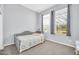 Neutral bedroom featuring comfortable bed and sunlit windows at 16961 W Holly St, Goodyear, AZ 85395