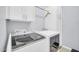 Functional laundry room with modern washer and dryer units and plenty of storage space at 16961 W Holly St, Goodyear, AZ 85395