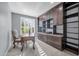 Home office with custom built-in shelving, ample workspace, and natural light at 16961 W Holly St, Goodyear, AZ 85395