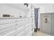 Spacious walk-in closet with custom shelving and drawers for optimal storage and organization at 16961 W Holly St, Goodyear, AZ 85395