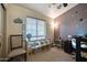 Bright bedroom with a window, shelf with storage, and carpeted floor at 17150 N 23Rd St # 125, Phoenix, AZ 85022