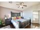 Charming bedroom featuring a dark wood bed set, bedside tables, and hardwood floors at 17150 N 23Rd St # 125, Phoenix, AZ 85022