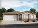 Charming single-story home featuring desert landscaping, a two-car garage and a neutral color palette at 17732 W Amber Dr, Goodyear, AZ 85338
