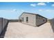 View of the home's backyard, featuring desert landscaping and block wall fencing for privacy at 18153 W Hiddenview Dr, Goodyear, AZ 85338
