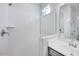 Modern bathroom showcasing a glass-enclosed shower, vanity, and sleek fixtures at 18153 W Hiddenview Dr, Goodyear, AZ 85338
