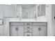 Bathroom featuring double sinks, granite countertops, and ample storage at 18153 W Hiddenview Dr, Goodyear, AZ 85338
