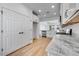 The open-concept kitchen is complete with granite countertops, and stainless steel appliances at 18153 W Hiddenview Dr, Goodyear, AZ 85338