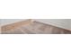 Close-up of bedroom flooring, showcasing neutral carpet and wall trim at 18248 W La Senda Dr, Surprise, AZ 85387