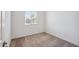 Bedroom featuring carpet, window and white walls at 18248 W La Senda Dr, Surprise, AZ 85387