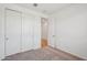 Bedroom with carpet, closet and white walls at 18248 W La Senda Dr, Surprise, AZ 85387