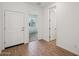 Entrance foyer featuring tile floors and access to additional rooms at 18248 W La Senda Dr, Surprise, AZ 85387