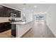 Bright, modern kitchen showcases dark cabinetry, a white countertop island, and tile floors at 18248 W La Senda Dr, Surprise, AZ 85387