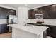 Updated kitchen featuring stainless steel appliances, granite countertops, and stylish backsplash at 18248 W La Senda Dr, Surprise, AZ 85387